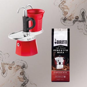 May include: A red Bialetti Moka pot with a black handle and a red cup. A bag of Bialetti ground coffee, labeled "PERFETTO MOKA", is also in the image. The coffee bag is dark red and black with the text "CIOCCOLATO" and "INTENSITÀ 8".