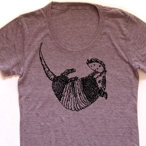 May include: A heather gray t-shirt with a black and white illustration of an armadillo.