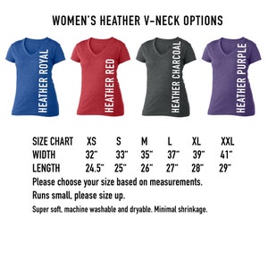 May include: Size chart for women's v-neck t-shirts in heather royal, heather red, heather charcoal, and heather purple. The chart shows sizes XS through XXL with corresponding width and length measurements in inches.