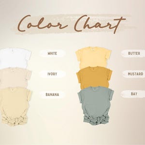 A color chart displays various t-shirt colors, including white, ivory, banana, butter, mustard, and bay. The text "Color Chart" is written in a brown, cursive font above the shirts. The shirts are neatly arranged, showcasing the different hues.