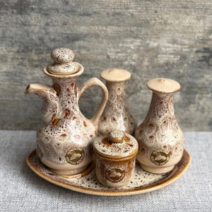 May include: A rustic wooden sign with the text "Welcome to our home" in a handwritten style. The sign has a distressed finish and a simple, inviting design, ideal for entryway decor.