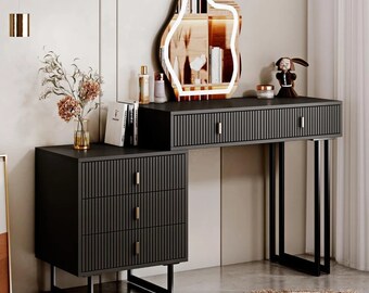 This contemporary vanity table features a retractable makeup dressing table, five spacious drawers, and a nightstand with a lit mirror.