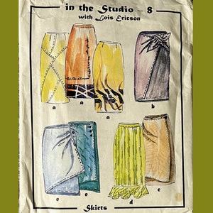May include: A sewing pattern envelope titled in the Studio - 8 with Lois Ericson Skirts, featuring watercolor illustrations of various skirt designs in yellow, orange, purple, blue, green, and tan, with visible stitching details and labels.