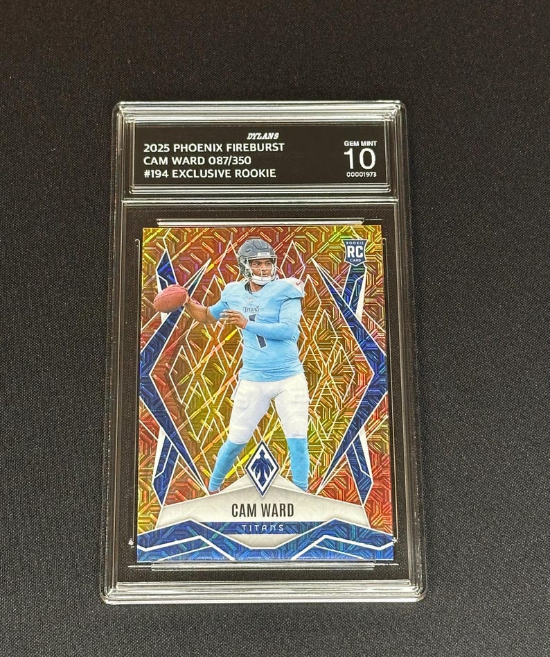 May include: A Cam Ward Titans rookie card from the 2025 Phoenix Fireburst series, graded GEM MINT 10. The card features a player in a light blue uniform throwing a football, set against a mosaic background with the text "CAM WARD TITANS".