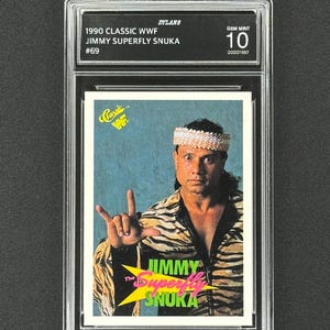 May include: A graded 1990 Classic WWF trading card featuring Jimmy "Superfly" Snuka. The card is encased in a clear plastic holder and is graded a Gem Mint 10. The card has a picture of Snuka in a tiger-striped jacket.