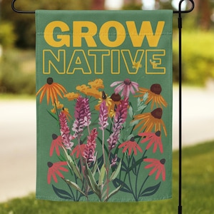 May include: A green garden flag displaying the text "GROW NATIVE" in yellow. The flag showcases a vibrant illustration of wildflowers, including orange and purple blooms. Ideal for adding a touch of nature to any garden.
