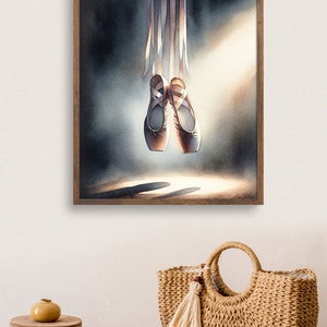 A high quality watercolor print in a wooden frame, showing a pair of Ballet Pointe Dancing Shoes.