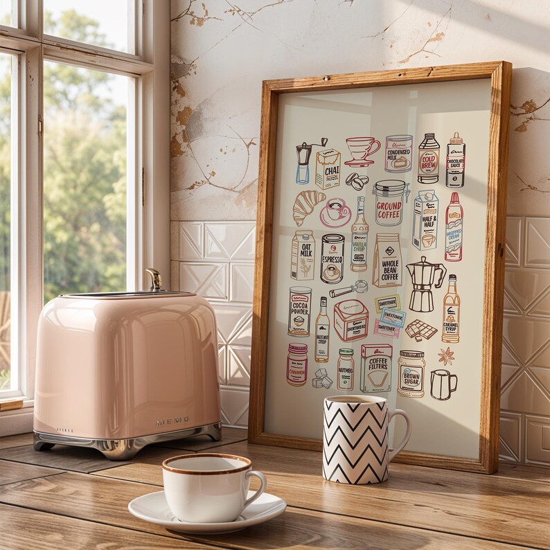May include: A framed wall art print featuring a collection of colorful line-art illustrations of coffee-related items, including a moka pot, croissant, milk cartons, syrups, and coffee beans, displayed on a wooden surface next to a pink toaster.