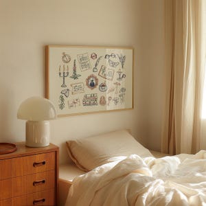 May include: A framed print with a collection of whimsical illustrations, including a clock, butterflies, books, and flowers. The artwork is in a light wood frame, displayed above a bed with cream-colored bedding. A white lamp sits on a wooden dresser.