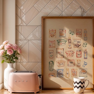 Puede incluir: Una tostadora rosa SMEG se encuentra junto a un jarr&oacute;n blanco con rosas rosas y una impresi&oacute;n enmarcada de alimentos ilustrados. Una taza blanca con un patr&oacute;n de zigzag negro est&aacute; en el mostrador. El fondo presenta una pared de azulejos claros.