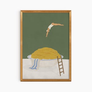 May include: A framed art print featuring a whimsical illustration. A person in a white swimsuit dives towards a large bowl overflowing with spaghetti. A small wooden ladder leans against the bowl, and a blue and white striped towel hangs over the edge.