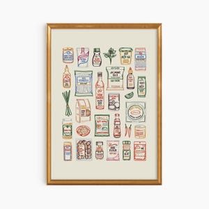 May include: A framed print featuring a colorful illustration of various Asian food ingredients. The artwork includes jars, bottles, and packages of items like fish sauce, rice, and spices, all with detailed labels and a vintage aesthetic.