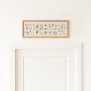 May include: A framed artwork featuring colorful line drawings of various food and drink items. The illustrations include bottles, glasses, and packaged goods, all set against a neutral background within a light wood frame. The artwork is hanging above a white door.