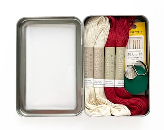 Visible Mending Kit No. 6: Thread, needles, and Stick and Stitch patterns for mending jeans and patching clothing.