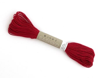 Olympus Sashiko Thread: Red cotton thread for visible mending or hand quilting.