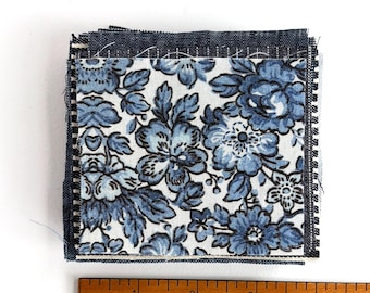 Small Blue Fabric Scraps: Pieces of natural fiber fabrics.