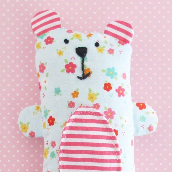 Mini Stuffed Teddy Bear: Soft toy bear made from floral fabric.