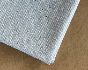 Essex Speckle in Chambray: FAT QUARTER of light blue fabric with colorful flecks.