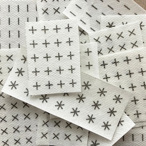 Visible Mending Stick and Stitch Patterns: Sashiko patterns on water soluble adhesive paper.