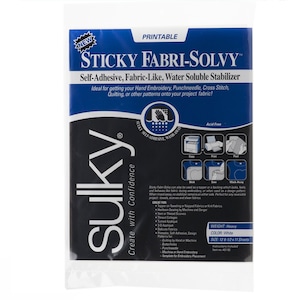 May include: A package of Sulky Sticky Fabri-Solvy, a self-adhesive, fabric-like, water-soluble stabilizer. The package has a white background with blue and black text. The product is designed for hand embroidery, punchneedle, cross stitch, and quilting projects. The package size is 12.5 x 11 inches.