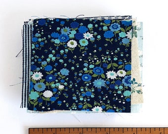 Tiny Blue Fabric Scraps: SMALL pieces of fabric pieces in solids, stripes, and florals.