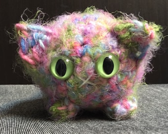 Crocheted pastel rainbow plush kitty