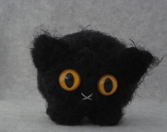 Crocheted black plush kitty
