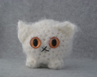 Crocheted white plush kitty