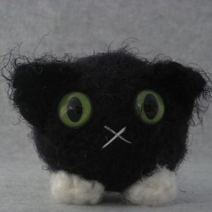 Crocheted black and white tuxedo plush kitty