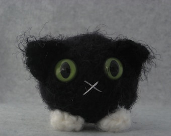 Crocheted black and white tuxedo plush kitty