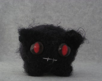 Crocheted spooky ghost monster plush kitty