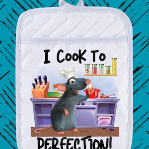 May include: White oven mitt with a cartoon rat chef design. The rat is in a kitchen, with the text "I Cook To Perfection!". The mitt has a quilted pattern and a loop for hanging.