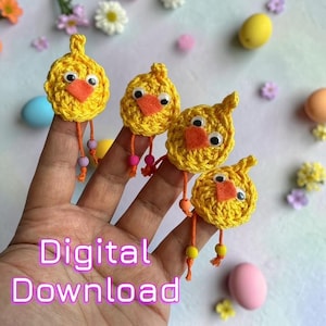 May include: Four handmade yellow crochet chick finger puppets with orange beaks and googly eyes. Each chick has dangling orange legs with colorful beads. The image includes the text "Digital Download".