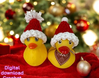 May include: Two yellow rubber ducks wearing red and white crocheted Santa hats. One duck has a white pom-pom on its hat, and the other has a brown bandana. The ducks are on a red surface with a Christmas tree in the background. The text "Digital download Crochet pattern" is visible.