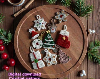 May include: A selection of handmade crochet Christmas decorations, including a tree, snowflake, and stocking, displayed on a wooden tray. The ornaments are white, red, and green, with decorative beads. The text "Digital download Crochet pattern" is visible.