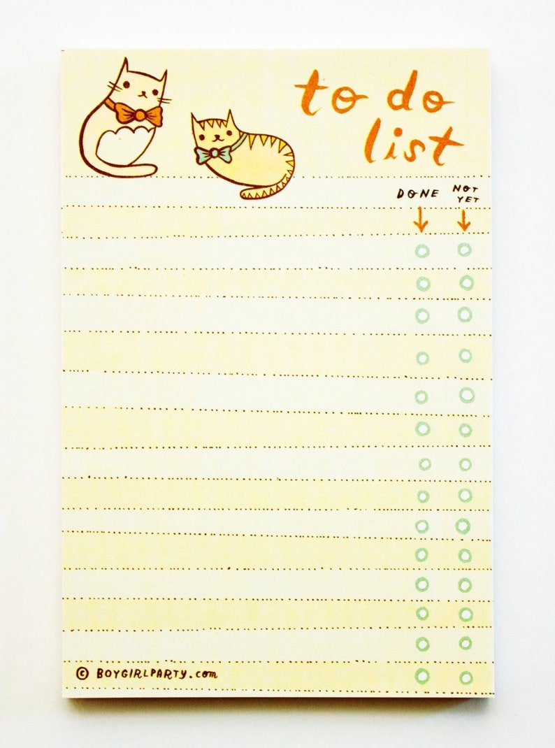 May include: A yellow to-do list notepad featuring a cat illustration and the text "to do list" at the top. The notepad has a dotted line pattern and a column of circles on the right side labelled "DONE" and "NOT YET".