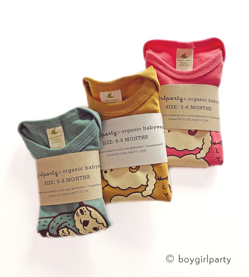 May include: Three organic cotton baby onesies in different colors and sizes. The onesies feature a cute animal graphic and the text "boygirlparty organic babywear" with the size and website address.