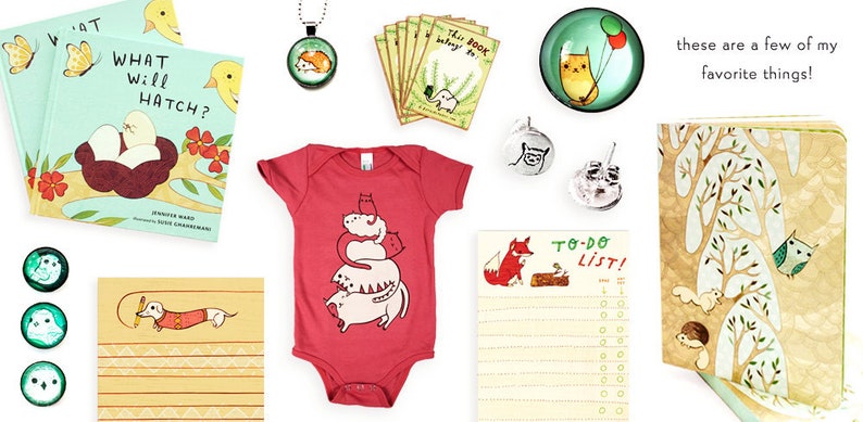 May include: A collection of items featuring cute animal illustrations.  The items include a book titled "What Will Hatch?", a red baby onesie with a stack of cats, a notepad with a fox and the words "To-Do List!" written on it, a small notebook with a woodland scene, and several small glass ornaments with animal designs.