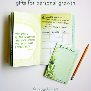 May include: A green and yellow journal with the quote "The world is the mountain, and each action, the shout that echoes back. - Rumi" on the left page. The right page has a table with the headings "Milestone", "Reward", and "Date Accomplished". A green to-do list notepad with a floral design and a yellow pencil are on the right side of the image.