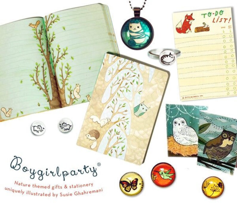 May include: A collection of nature-themed stationery and gifts, including a notebook with a tree illustration, a to-do list notepad with a fox illustration, and a variety of charm pendants featuring animals like owls, butterflies, and hummingbirds. The text "Boygirlparty" and "Nature themed gifts & stationery uniquely illustrated by Susie Ghahremani" is visible on the image.