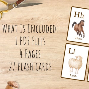 May include: A set of 27 alphabet flash cards featuring illustrations of animals and objects. The cards are printed on white paper with brown borders and feature the letters H, I, L, and M.