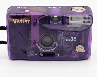 Fotocamera vintage Vivitar CV35 viola trasparente da 35 mm, punta e scatta, stile retrò anni '90.