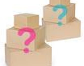 May include: Two stacks of brown cardboard boxes, each with a different size box. One stack has a pink question mark, and the other has a teal question mark, suggesting a gender reveal or mystery gift.