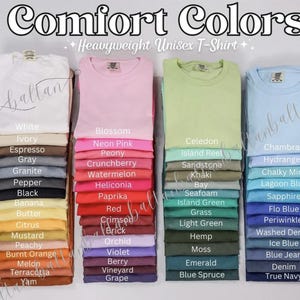 May include: A color chart of Comfort Colors Heavyweight Unisex T-Shirts. The chart shows 24 different colors, including white, ivory, espresso, gray, granite, pepper, black, banana, butter, citrus, mustard, peachy, burnt orange, melon, terracotta, yam, blossom, neon pink, peony, crunchberry, watermelon, heliconia, paprika, red, crimson, brick, orchid, violet, berry, vineyard, grape, celedon, island reet, sandstone, khaki, bay, seafoam, island green, grass, light green, hemp, moss, emerald, blue spruce, chambray, hydrangea, chalky mint, lagoon blue, sapphire, flo blue, periwinkle, washed denim, ice blue, blue jean, denim, and true navy.