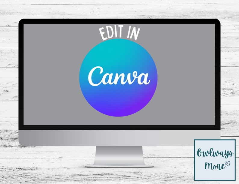 May include: A computer screen displaying the text "Edit in Canva" in white letters on a blue, purple, and teal gradient circle. The background is gray. The computer is on a white wooden surface.