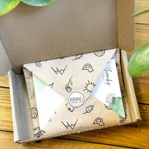 an open box with a piece of paper inside of it