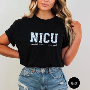 May include: Black t-shirt with a white graphic that says "NICU" with a blue floral pattern. The text below says "neonatal intensive care unit".