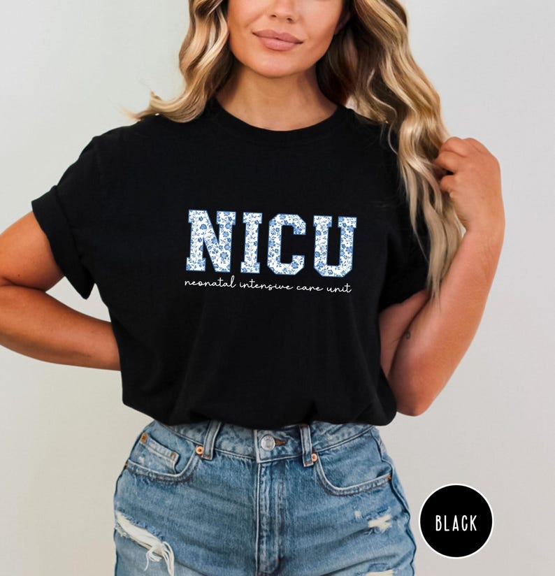 May include: Black t-shirt with a white graphic that says "NICU" with a blue floral pattern. The text below says "neonatal intensive care unit".