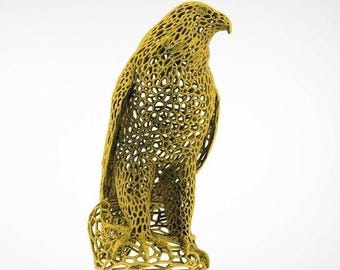 May include: A gold-colored, 3D printed sculpture of a bird, possibly a falcon or hawk, with a detailed, intricate, and delicate design. The sculpture is made of a mesh-like material, creating a unique and artistic look.