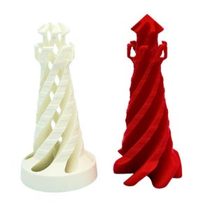 May include: Two 3D printed chess pieces, one white and one red, in the shape of a tower with a spiral design.